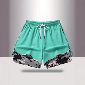 Pantaloncini sportivi doppio strato verde menta da donna con interno camo e coulisse.