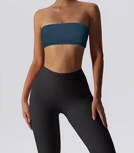 Close-up detail of a seamless strapless blue sports tube top with black leggings