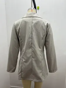Back view of a slim fit solid color blazer jacket for women on a mannequin