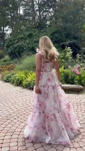 Back view of a floral organza evening gown featuring an elegant lace-up back design.