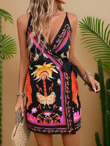 Close-up of a sexy black V-neck slip dress with colorful tropical butterfly prints