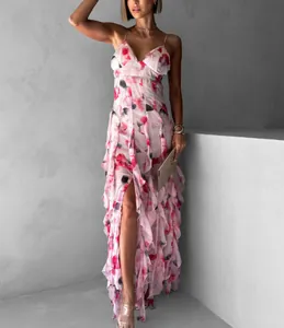 Elegant floral print chiffon maxi dress with ruffled layers and side slit shown on model