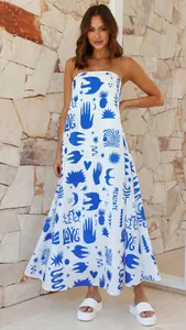 Elegant strapless white maxi dress with bold blue graphic prints perfect for summer vacation