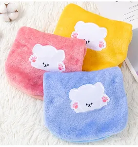 Close-up of soft and warm plush pet clothes for small dogs featuring cute bear appliques