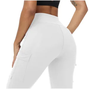 Detail view of white high waisted yoga pants featuring functional side cargo pockets