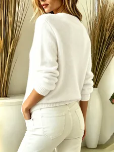 Back view of a cozy white fuzzy long sleeve knit sweater for women's autumn winter fashion.