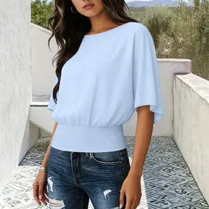 Detail of the elegant smocked waist and soft blue fabric on this stylish women top