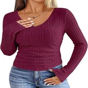 Detail view of a slim-fit maroon ribbed V-neck long sleeve shirt with brushed texture.