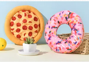 Detail of pizza and pink donut shaped squeaky plush toys for dogs in a lifestyle setting