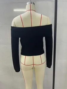 Back view of black off-the-shoulder ribbed knit long sleeve sweater on mannequin.