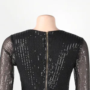 Close-up of back gold zipper detail on sexy black sequined bodycon party dress