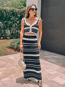 Stylish black and white striped crochet tank top and high-waisted midi skirt set.