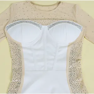 Detailed view of the sparkling rhinestone mesh and white corset bodice on this bodycon dress.