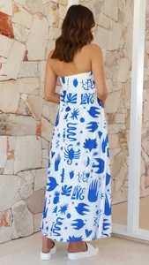 Back view of a strapless blue and white printed maxi dress for summer vacation
