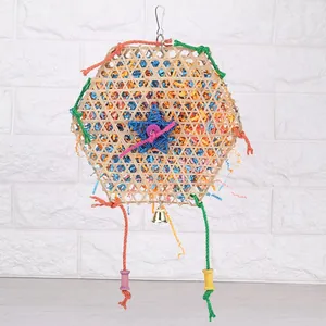 Detailed shot of a colorful bamboo woven parrot foraging toy with shredded paper