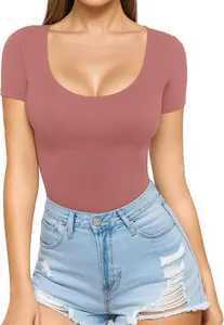 Close-up of women's mauve scoop neck short sleeve slim fit bodysuit tucked in denim shorts