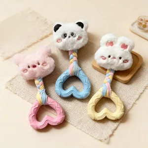Detail view of plush animal head squeaky dog toys with heart-shaped chew ring set