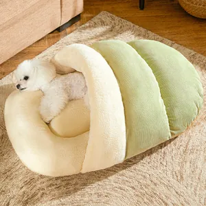 Cozy semi-enclosed pet bed with plush lining and green corduroy exterior for cats and dogs