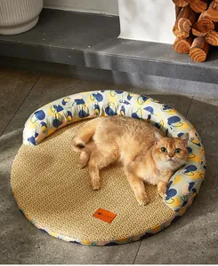 Ginger cat resting on a round woven pet cooling mat with artistic pattern border.
