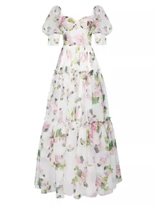 Detailed shot of an elegant floral organza dress showing puff sleeves and tiered skirt