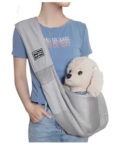 Detailed macro view of the breathable gray mesh fabric and strap on this portable pet carrier