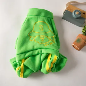 Close-up detail of vibrant green pet sports sweatshirt with yellow dog face embroidery