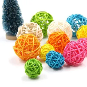 Detailed view of colorful woven rattan balls designed for parrots and small animal chewing