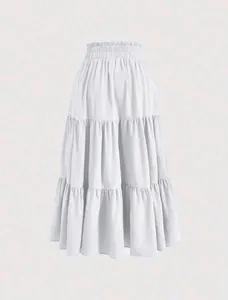 Detail view of a white tiered plus size maxi skirt with elastic ruffled waist