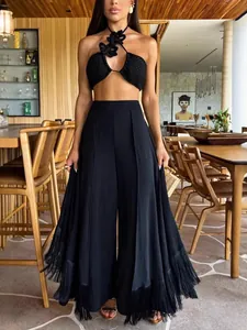 Elegant black wide-leg trousers with stylish fringe hem for a chic commute look.