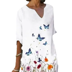 Vintage loose white linen dress featuring butterfly and floral prints with V-neckline