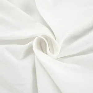 Close-up of the high-quality breathable white cotton linen fabric texture