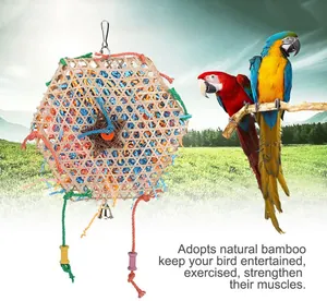 Natural bamboo parrot foraging toy with colorful shredded paper and climbing ropes for birds