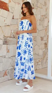 Detailed view of white strapless maxi dress with blue Mediterranean-style illustrative prints