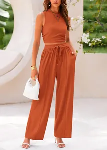 Chic two-piece ribbed knit set featuring a sleeveless crop top and wide-leg trousers.