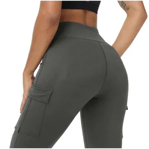 Close-up of grey high-waisted yoga leggings with functional side cargo pockets.