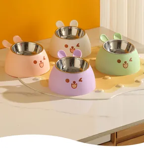 Macro view of multi-colored rabbit-shaped pet feeding bowls with stainless steel liners
