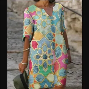 Vintage V-neck dress with colorful geometric patterns and five-quarter sleeves.