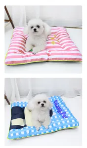 Detail view of pink striped and blue checkered splash-proof dog sleeping mats for pets