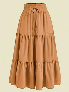 Detailed view of a caramel tiered plus size maxi cake skirt with drawstring waistline