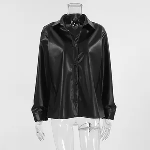 Front detail of a vintage black long-sleeve PU leather button-down shirt on mannequin
