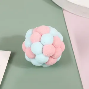 Soft plush cat toy ball in pastel blue and pink colors with fuzzy texture