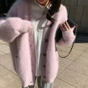 Detail of the soft pink fuzzy imitation mink fur cardigan texture and comfortable loose fit