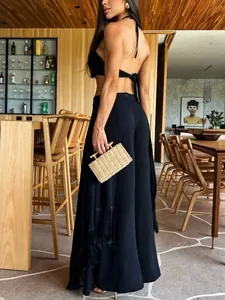 Elegant black wide-leg flared trousers with long fringe detailing for stylish women
