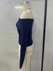 Side view detail of navy blue off-the-shoulder long sleeve knitted sweater on mannequin
