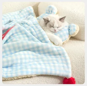 Cozy blue and white gingham pet blanket with a matching bear-ear plush pillow for cats