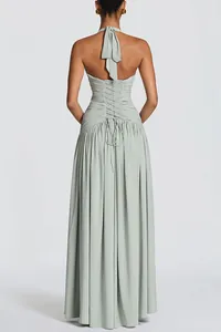 Back view of elegant sage green halter neck maxi dress with corset lace-up details