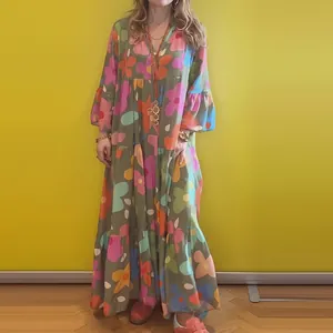 Detail of a floral print long-sleeve maxi dress with loose silhouette and V-neck.