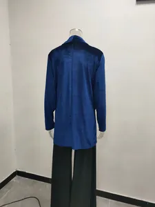 Rear view detail of a loose fit royal blue velvet long-sleeve cardigan on a mannequin.