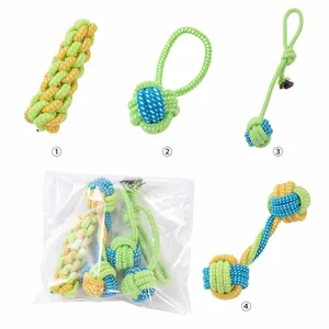 Detailed view of four colorful braided cotton dog rope toys in clear plastic packaging.