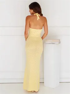 Elegant yellow knitted halter neck maxi dress with backless design for a sexy beach cover-up